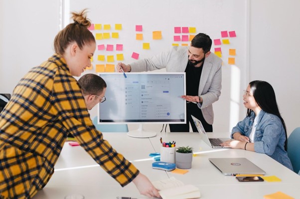 team of people discussing work